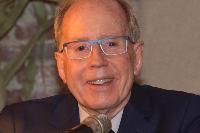 Closeup photo of Ronald Prinn at a lectern